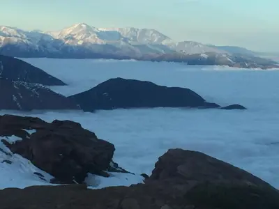 a view from the top of a mountain over a body of water at Chalet tizrag in Oukkainrdem