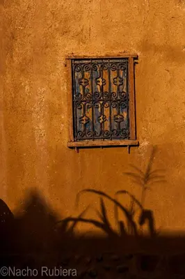 a shadow of a window on the side of a wall at Dune House in Merzouga