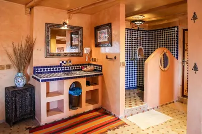 a bathroom with a sink and a counter in a room at Dune House in Merzouga
