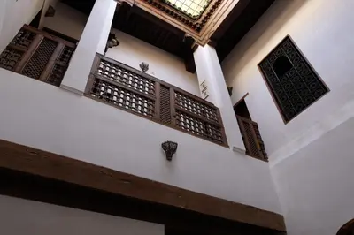 a building with a balcony and a window at Dar Houdou in Fès