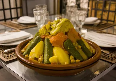 a bowl of vegetables on top of a table at Dar El Bali in Fès