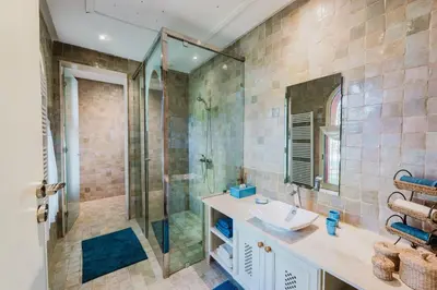 a bathroom with a sink and a shower at Dar Kamango in Marrakech