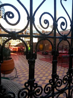 a view of a wrought iron gate in a building at Karim Sahara in Zagora