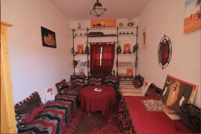 a living room with a couch and a table at Karim Sahara in Zagora