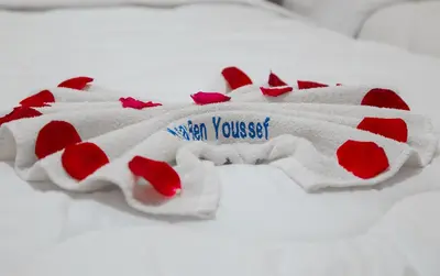 a red and white blanket with hearts on it at Ksar Ben Youssef in Ouarzazate