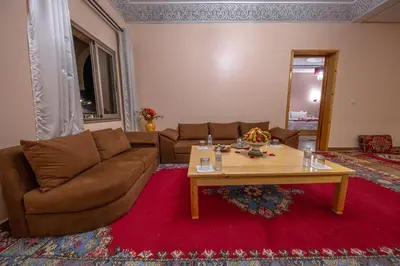 a living room with a couch and a coffee table at Ksar Ben Youssef in Ouarzazate
