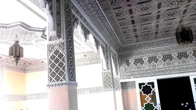 a room with a ceiling with intricate designs on it at Riad Dar Zidane in Meknès