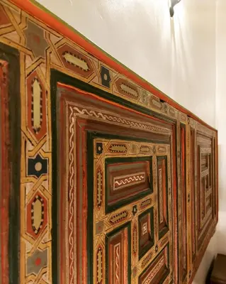 a close up of a wooden door on a wall at Dar Hayati in Fès