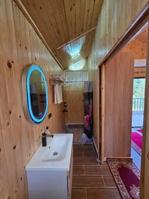 a bathroom with a white sink and a mirror at Top Ourika in Aghbalou