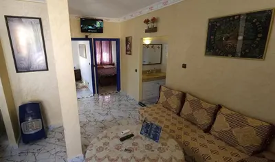 a living room with a couch and a table at Top Ourika in Aghbalou