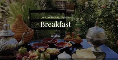 a table topped with bowls of cheese and other food at Les Jardins de Skoura in Skoura