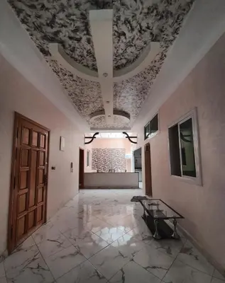 a room with a ceiling with a table in it at AMAZIGH ouargaga APARTMENT in Meknès