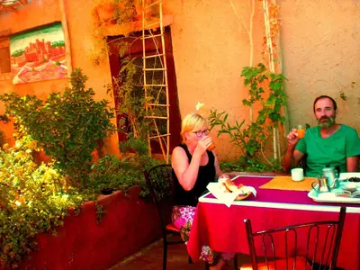 a man and a woman sitting at a table at Kasbah La Datte D'or in Skoura
