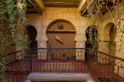 an entrance to a building with a brown door at Rose Noire in Ouarzazate