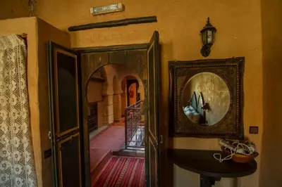 an entrance to a room with a door and a hallway at Rose Noire in Ouarzazate