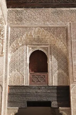 an ornate window in a building with white tiles at Dar Rbab in Fès