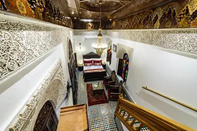 a view of a hallway with a staircase and a church at Riad Rcif & Spa Originale in Fès