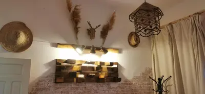 a room with a wall with a chandelier and a wall at Atlas Room in Midelt