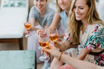 a group of people holding glasses of wine at Riad Anata in Fès