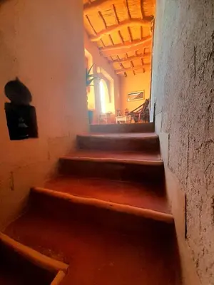 a stairway in a building with wooden steps at Les Jardins du M'goun in Kalaat MGouna