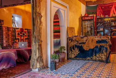 an entrance to a room with a table and a door at Hôtel Chellal ďOuzoud in Ouzoud