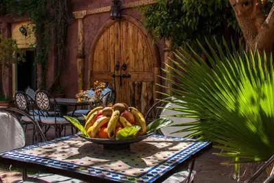 a bowl of fruit sitting on a table on a table at Hôtel Chellal ďOuzoud in Ouzoud