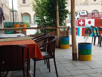 a table and chairs sitting on a patio at Auberge des lacs in Imilchil