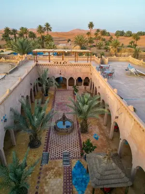 an aerial view of a building in the desert at Auberge Les Roches in Merzouga