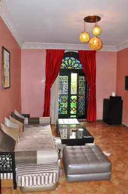 a living room with two couches and a window at Palais Ommeyad Suites & Spa in Fès