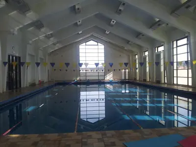 a large swimming pool with blue water at Farah Inn Ifrane in Ifrane
