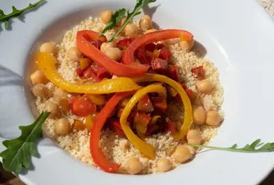 a plate of couscous with chickpeas and peppers at Auberge le Maquis in Aghbalou