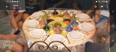 a table with plates and utensils on top at Dar Pa Labzioui in Meknès
