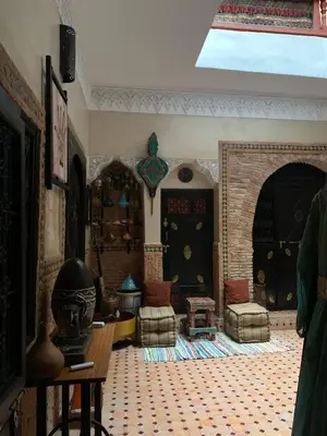 a living room with a couch and a table at Dar Pa Labzioui in Meknès
