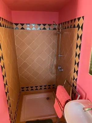 a bathroom with a shower and a sink at Riad Marrakech Ourika in Marrakech