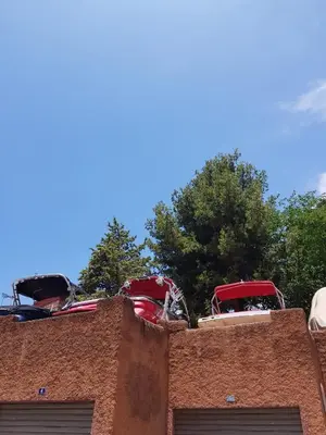 a pile of cars sitting on top of a building at Appart Bin Elouidane in Bine el Ouidane