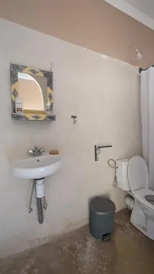 a bathroom with a sink and a toilet at Kasbah Desert Camp in Mhamid