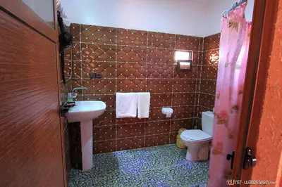 a bathroom with a sink and a toilet at La Porte du Dades in Boumalne