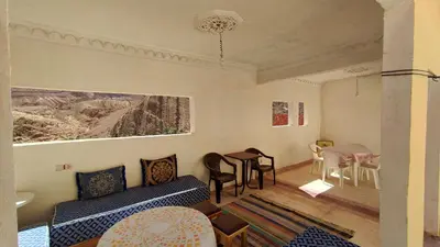 a living room with a couch and a table at Myhouse Todgha in Tinerhir