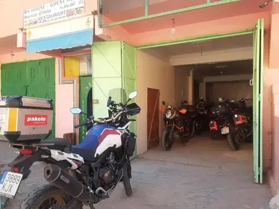 a group of motorcycles parked inside of a garage at Myhouse Todgha in Tinerhir