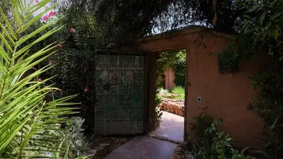 an entrance to a house with an open door at Asnouss in Marrakech