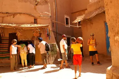 a group of people standing outside of a building at Maison d'hôtes Dar El Nath in Ouarzazate