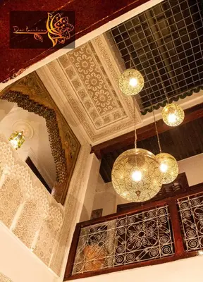 a room with a ceiling with a chandelier at Dar Lantana in Fès