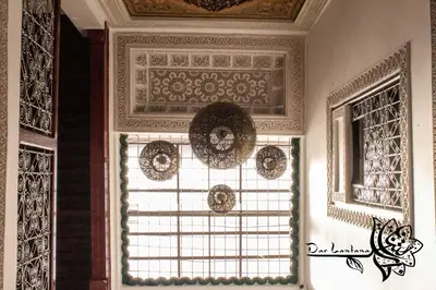 a room with a window with plates on the ceiling at Dar Lantana in Fès