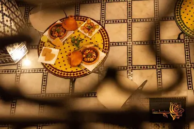 a table with two plates of food on it at Dar Lantana in Fès