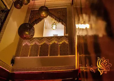 a mirror on a wall in a room at Dar Lantana in Fès