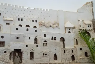 a large white building with windows and a wall at Dar Sunrise Fes in Fès
