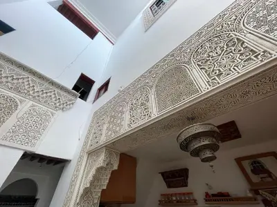 an entrance to a building with an ornate ceiling at Dar Sunrise Fes in Fès