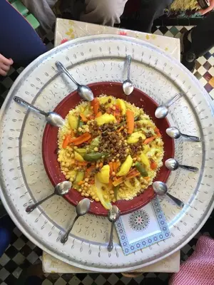 a plate of food with spoons on top of it at Dar Sunrise Fes in Fès