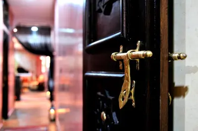 an open door with a brass latch on it at Luxury Riad Saad Fes- Apart in Fès
