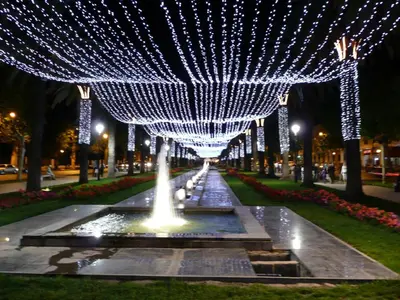 a fountain with lights in a park at night at Luxury Riad Saad Fes- Apart in Fès